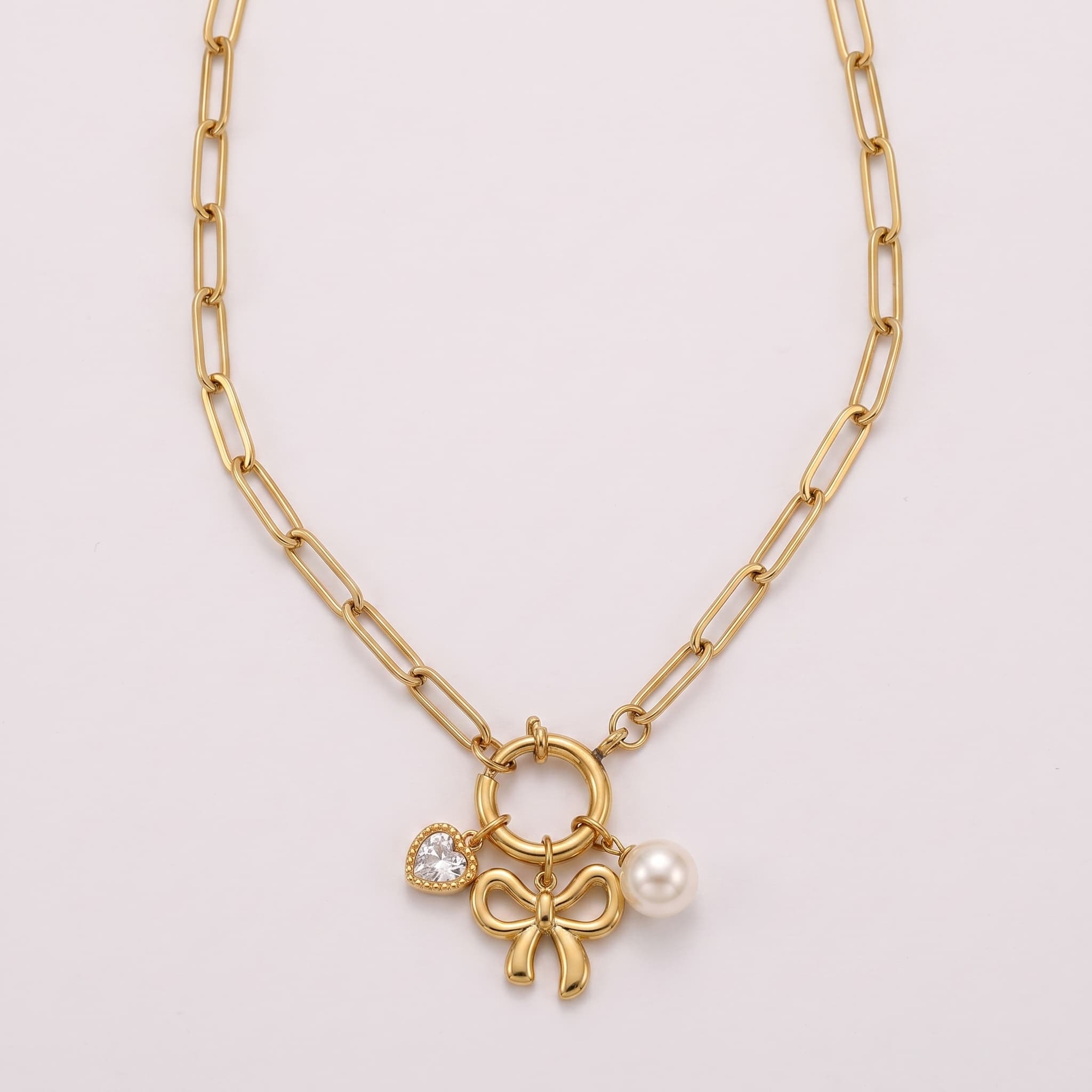 pearl and bow charm necklace