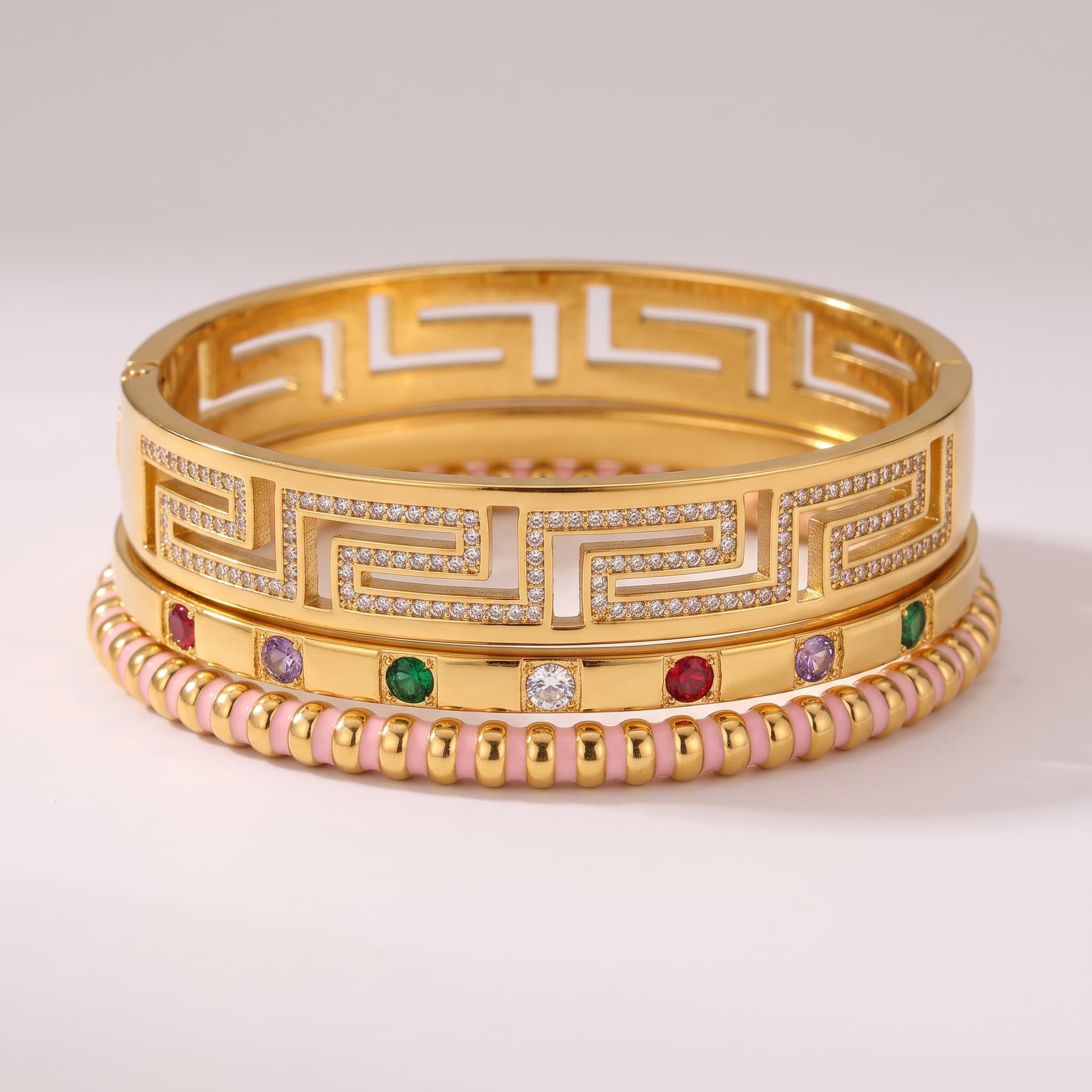 trio of gold tone bangles