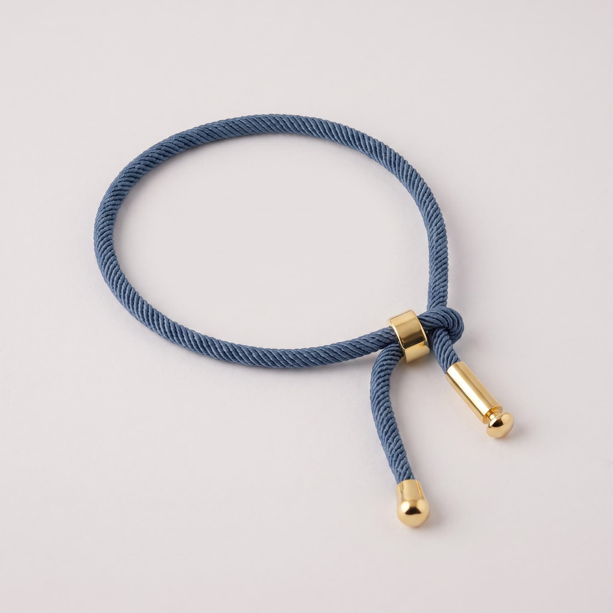 blue cord gold charm Rakhi