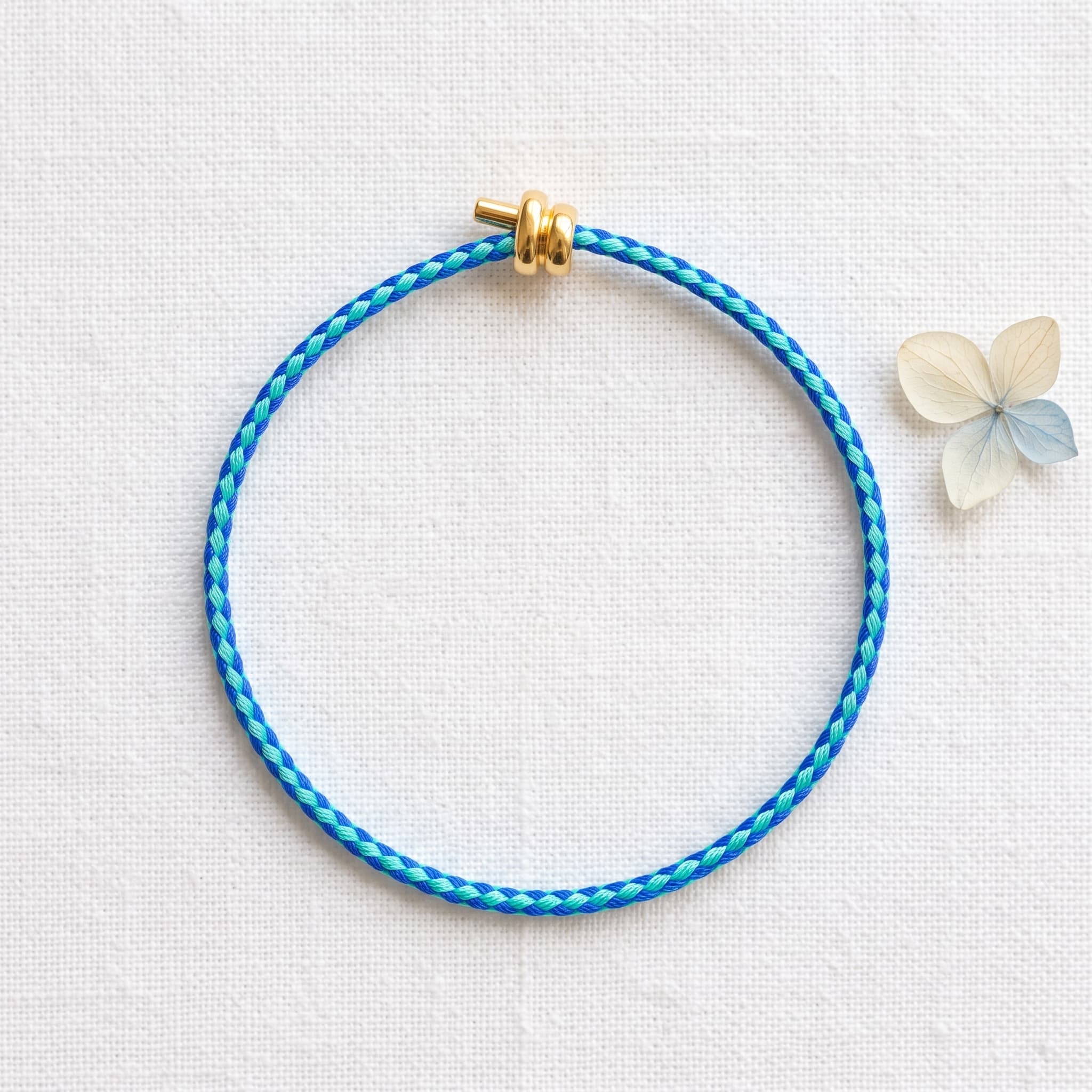 blue and green braided cord bracelet