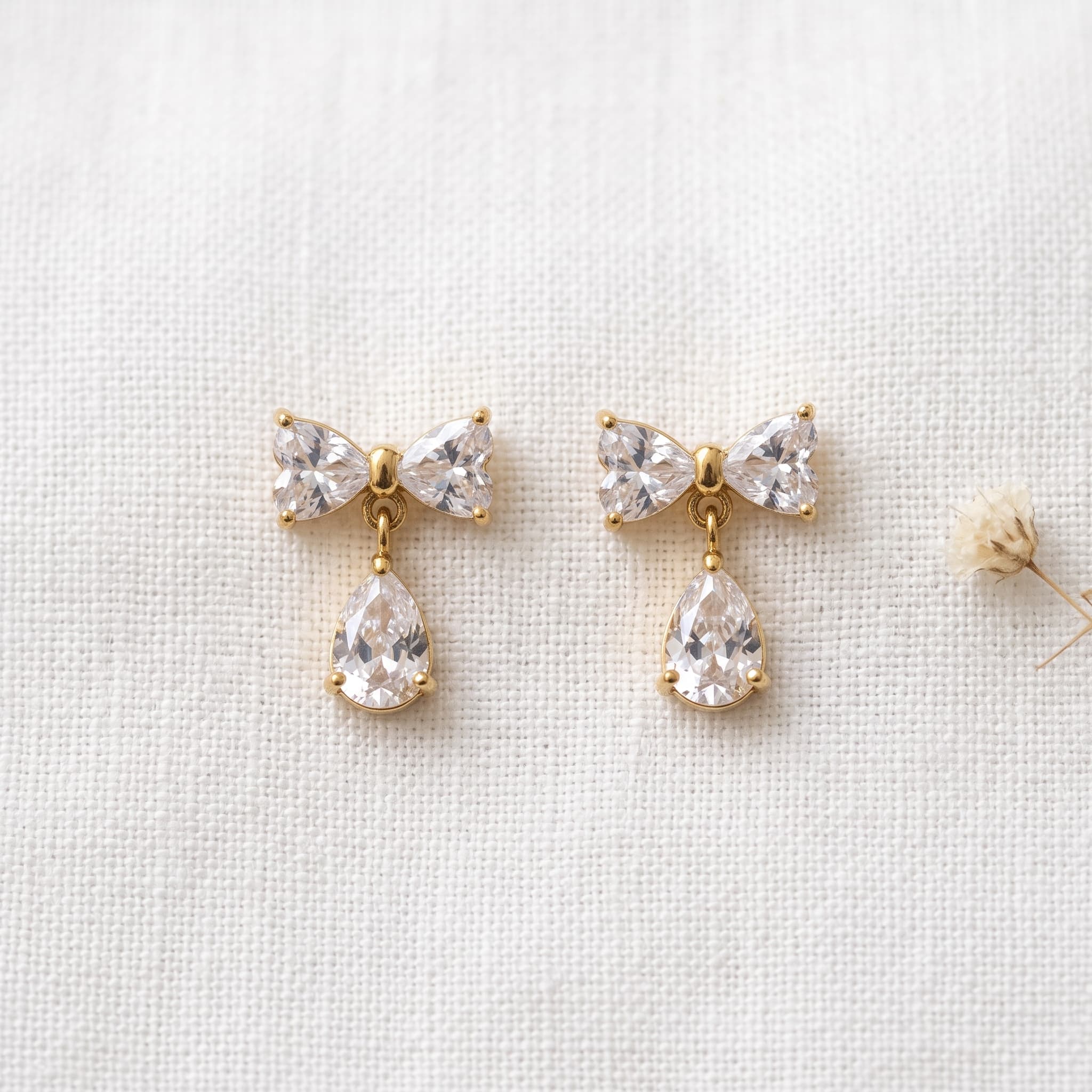 dainty bow and teardrop studs