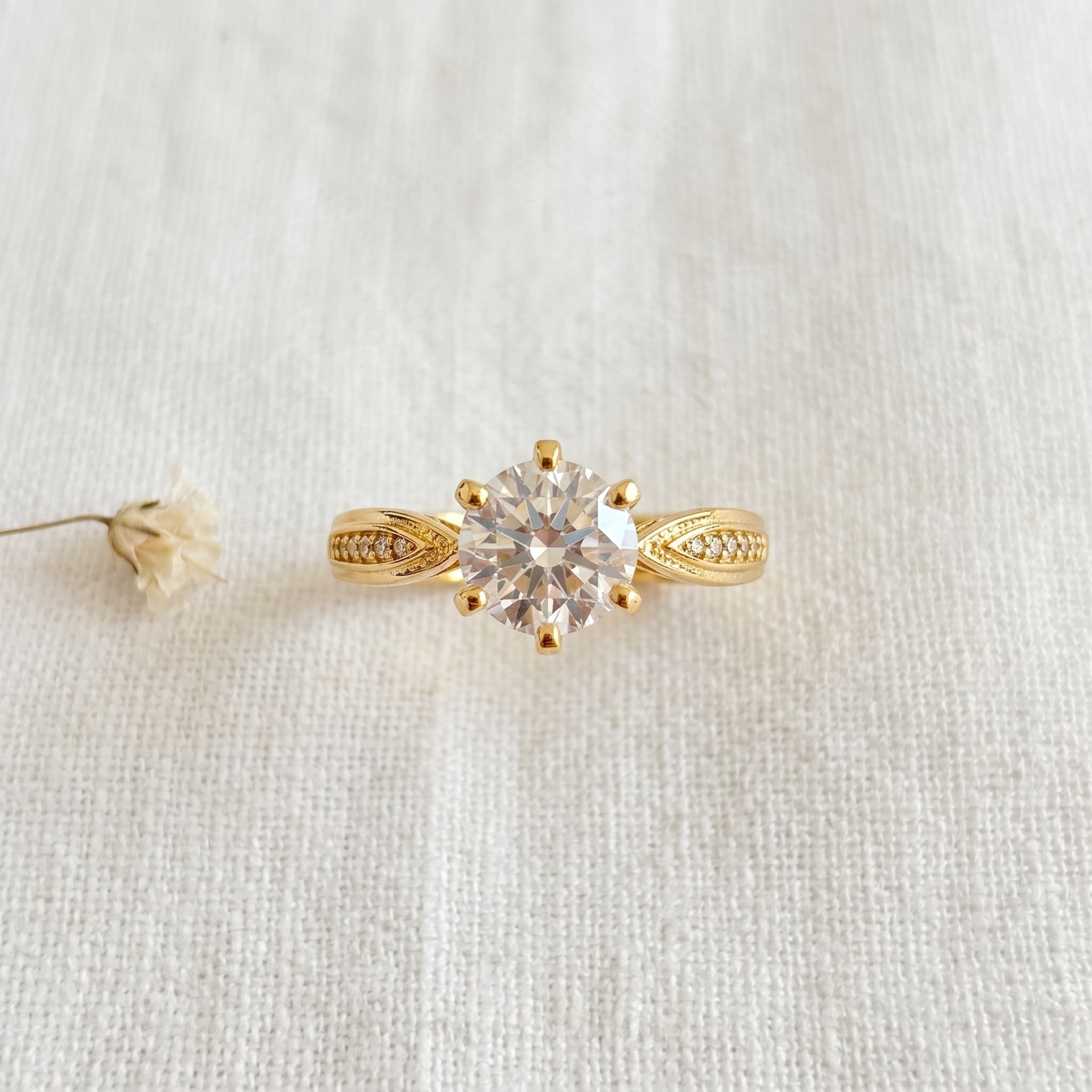 dainty gold solitaire ring