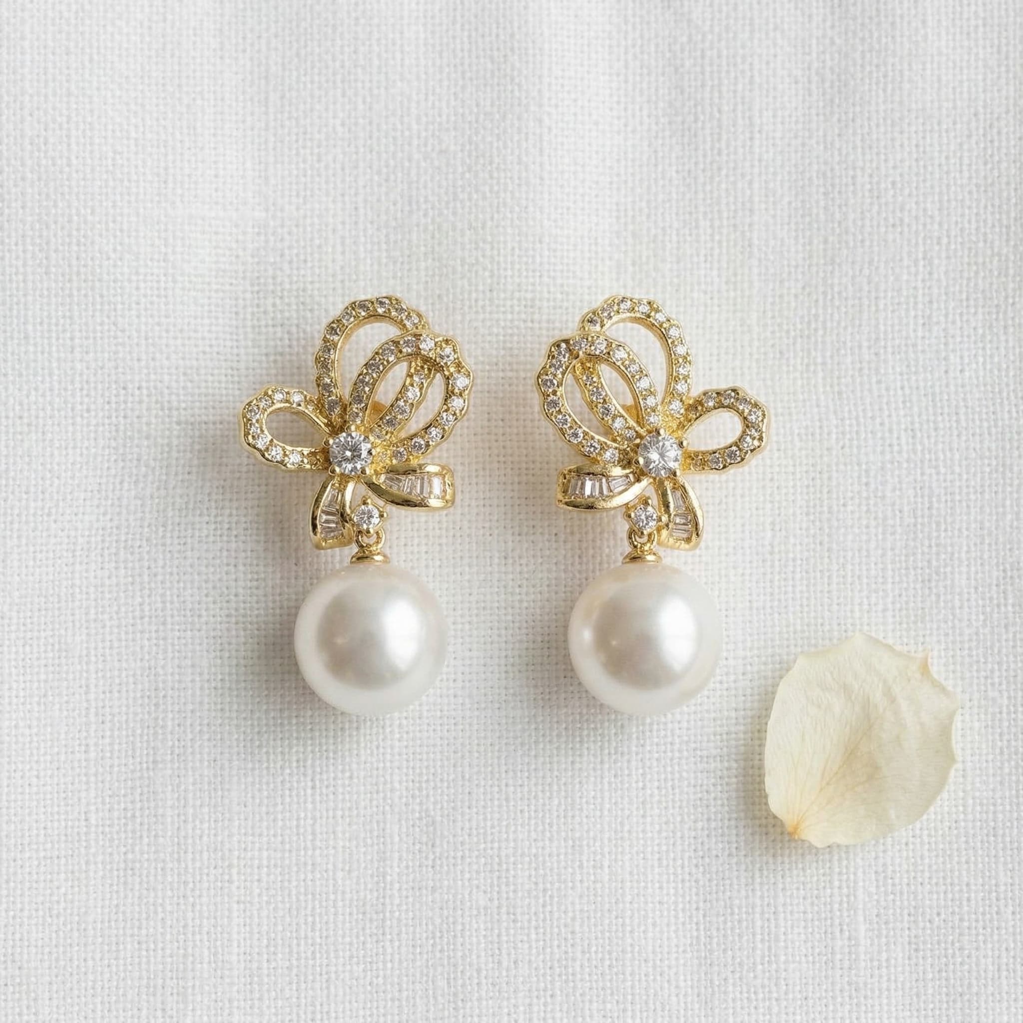 pearl and bow drop earrings