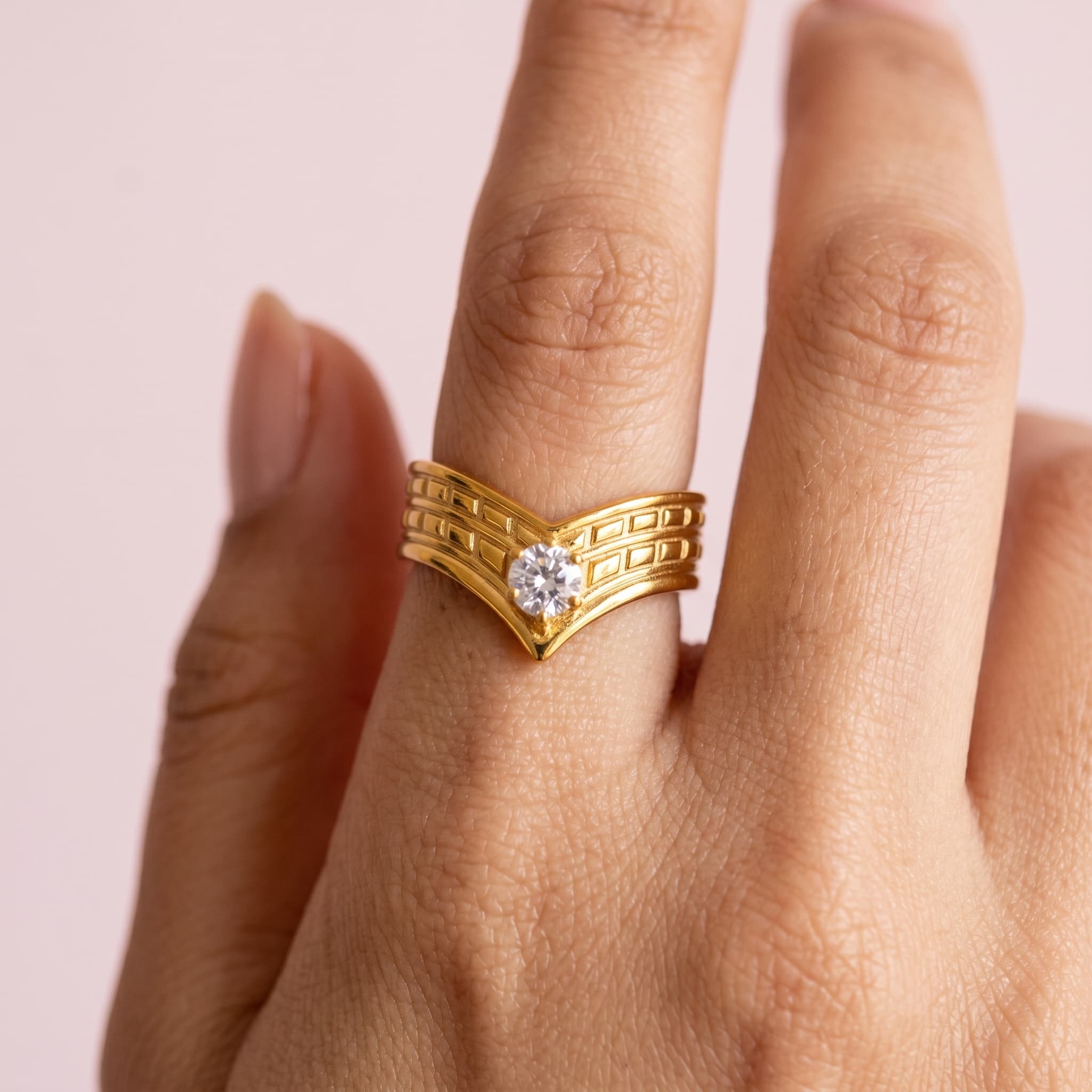 v-shaped golden stone ring
